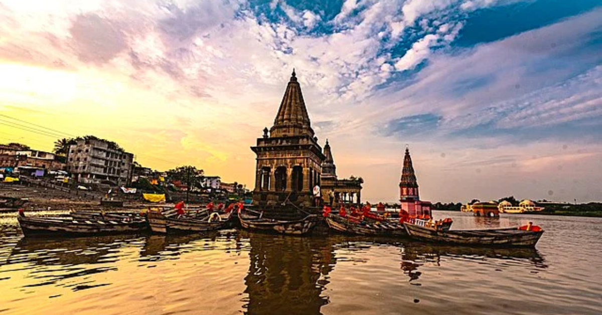Sunrise over Chandrabhaga River with saffron flags