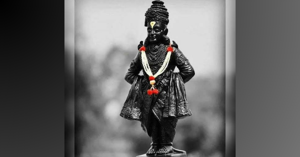 Lord Vitthal standing on a brick